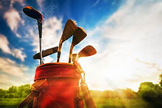 Professional golf clubs at sunset
