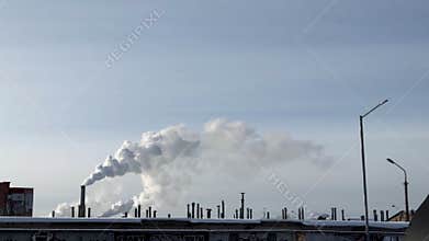 Smoke from industrial chimneys on sunny day. Air pollution from factory pillars, sky. Ecology danger concept