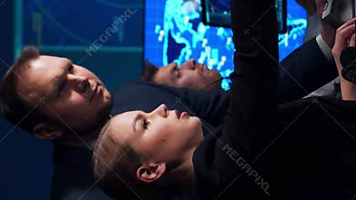 Workplace of the air traffic controllers in the control tower. Team of professional aircraft control officers works