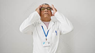 Stressed middle-aged latin scientist in uniform rubbing his aching head. a grey-haired man suffering from stress-induced migraine