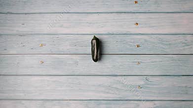 Variety of fresh organic peppers on a wooden surface. Top view. Animation