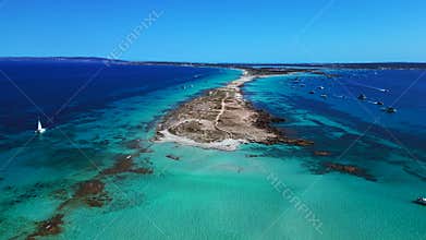 Ibiza Formentera Borronar beach turquoise water. Smooth aerial view flight drone