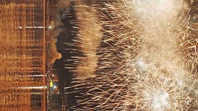 Fireworks with colorful lights over sea