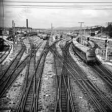 Railway tracks leading to industrial complex