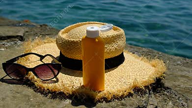 Sunscreen against the sea. Selective focus.