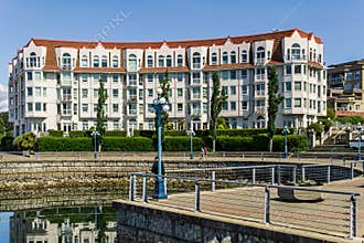 VICTORIA, CANADA - JULY 14, 2019: pathway in front of residential condo building on sunny day with blue sky.