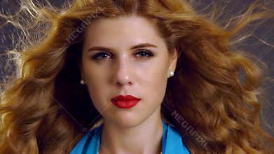 Slow motion flying hair and woman face with hypnosis look