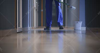 Janitor cleaning a corridor
