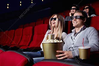 Laughing people at the cinema