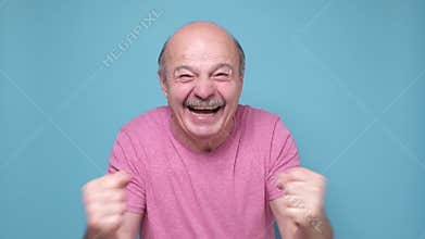 Ecstatic emotional male fan cheering for favorite sport team
