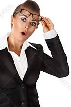 Surprised business woman with eyeglasses in hand