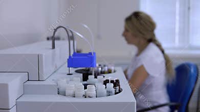 Remote work of laboratory assistant at computer controlling chemical analyzer