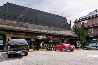 BOWEN ISLAND, CANADA - JUNE 2, 2019: shopping area in small island municipality with shops restaurants cars