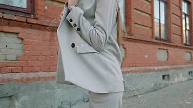 Beautiful european fashion model girl is posing on city street.