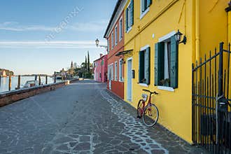 Bicycle in front of a yellow house in Burano
