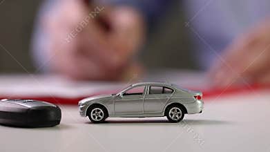 Buy new car concept - signing contract in office