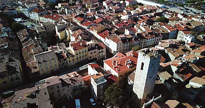 Aerial footage of Antibes, France, Cote D Azur. Beautiful sunny day in Mediterranean Sea. Old castle and sea. Roofs and