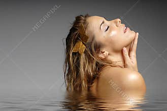 Beautiful woman bathing in water - spa