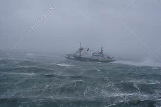 Storm,rain and a fishing boat.