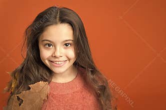 Keep skin healthy in fall. Little child wear leaves in long hair. Skincare routine for autumn. Natural skincare