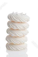 Stack of meringue nests on white