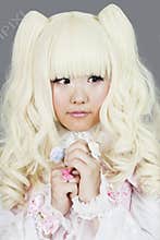 Portrait of japanese cosplayer wearing pink dress