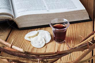 Holy Communion, a Cup of Wine and Bread with a Jesus Crown Thorn and Holy Bible