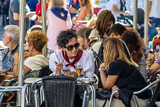 People in a street cafe at the Fiesta de San Mateo - Rioja Wine Harvest Festival