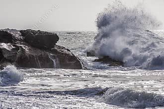Sea waves crash on the rocks in front of the beach of Ajuy, Fuerteventura, Canary Islands, Spain