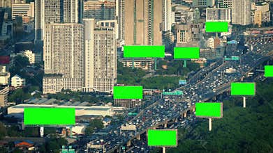 Green screen billboards in city landscape