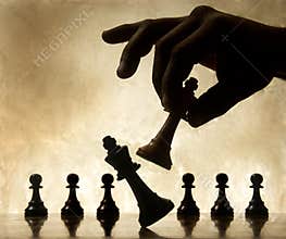 Hand moving chess piece