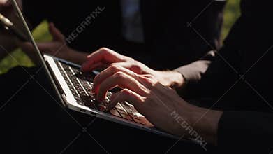 Cropped video illustration of fast speed typing hands coding notebook modern wireless technology outdoor working