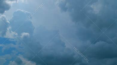 Time lapse. Cumulus clouds moves in the blue sky. Extreme weather before rain or snow.
