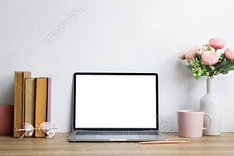 Mock up with books, coffee and pink roses flower on wooden table.