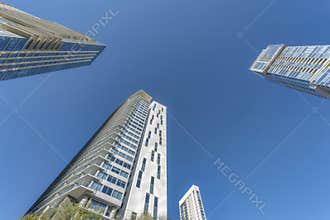 Exterior of modern apartments and condiminiums with blue sky background