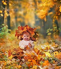Little girl in maple leaves