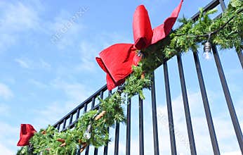 Pine Bough and Red Bows on Wrought Iron Fence 4