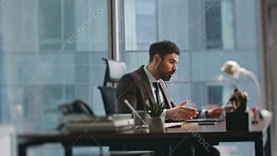 Frustrated boss arguing distant meeting sitting office. Manager shouting laptop