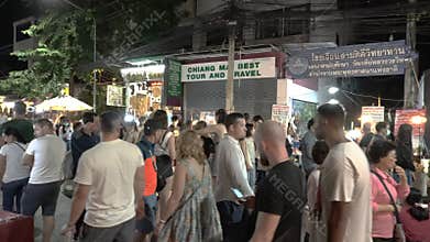 Crowded people walking night street market. life style in the night on the street Chiangmai, Thailand
