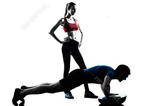 Coach man woman exercising abdominals with bosu