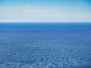natural abstract background of calm sea and clear sky