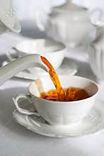 Pouring fresh tea.