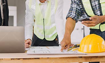 Diverse Team of Specialists Use Tablet Computer on Construction Site. Real Estate Building Project with Civil Engineer, Architect