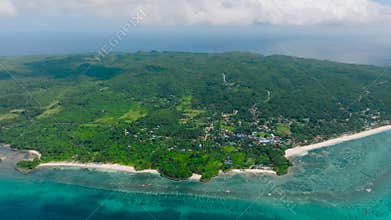 Serene tropical island and sandy beaches. Carabao Island, Romblon, Philippines.