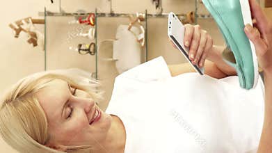 Young woman captures a trendy turquoise shoe in a chic boutique