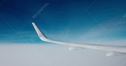 Flying with airplane above white cloudscape against blue sky horizon, freedom flight above the clouds video