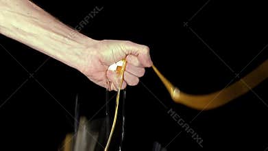 Hand crushing an egg