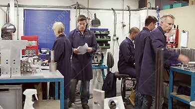 Time Lapse Sequence Of Busy Engineering Workshop