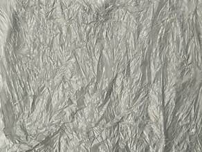 Abstrack grey crumpled plastic bag texture background