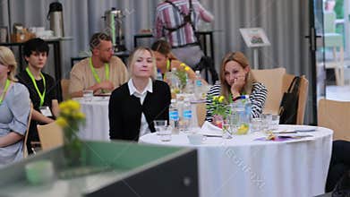 Minsk, Belarus 20.09.23: Business lunch exhibition marketing. People participants of the marketing and business conference at the